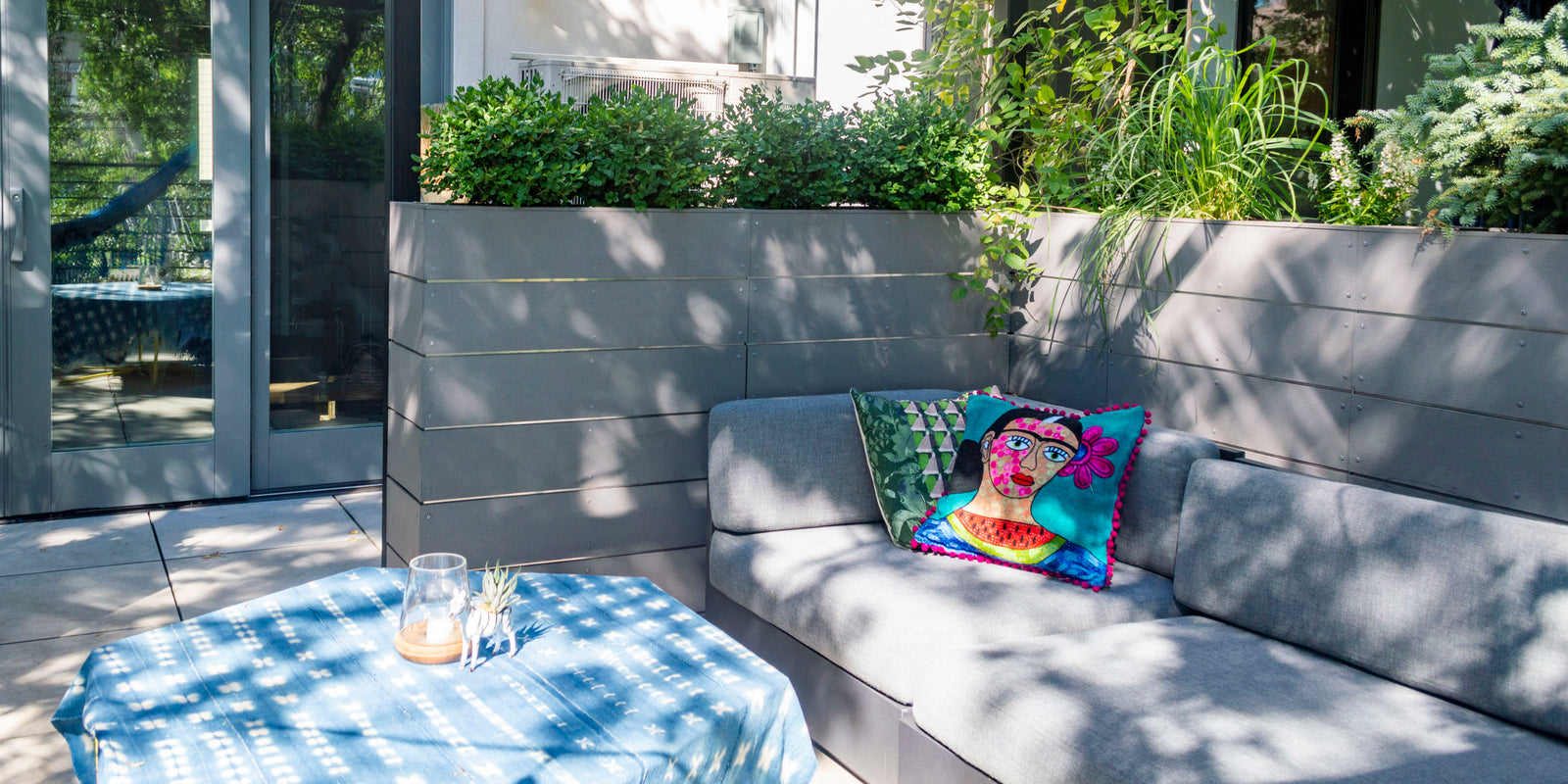 Outdoor terrace with tall modern planters